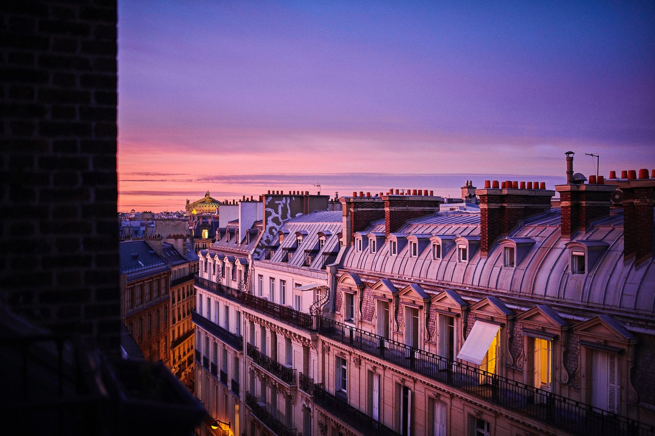 Paris by night-view-sunset-roofs - Normandy Hotel Paris